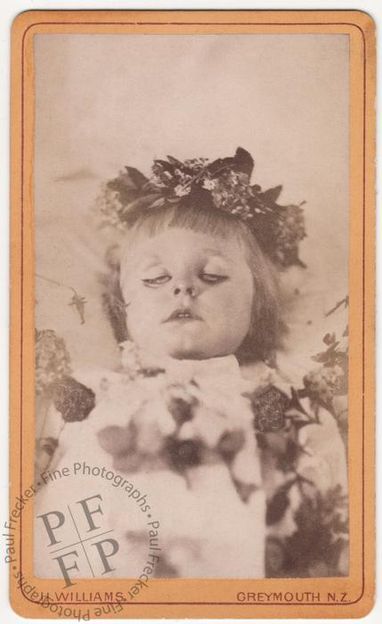 Girl wreathed with flowers