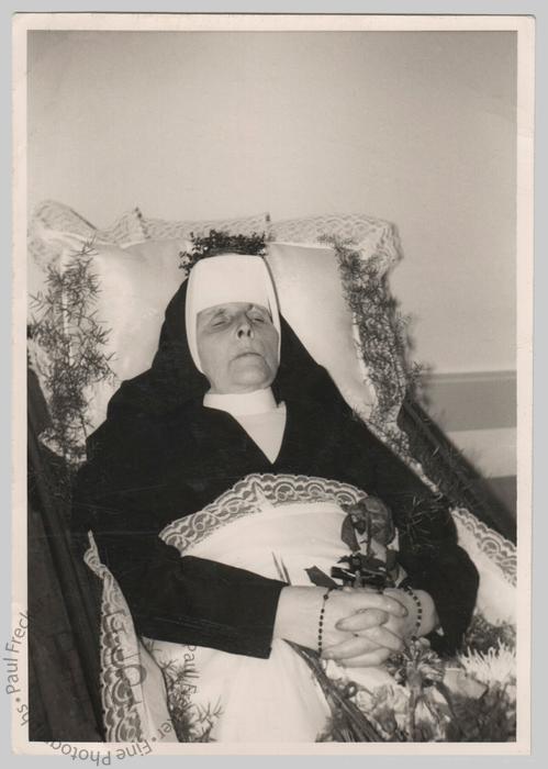 Nun with flowers and ferns