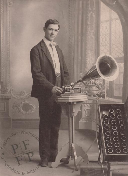 A young man with a Graphophone