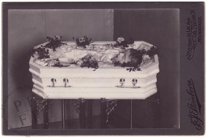 Child in a white coffin