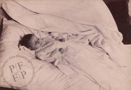 Infant in a christening gown