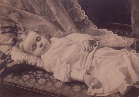 Child on cushions and a sofa