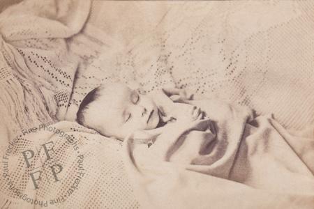 Baby on a crocheted bedspread